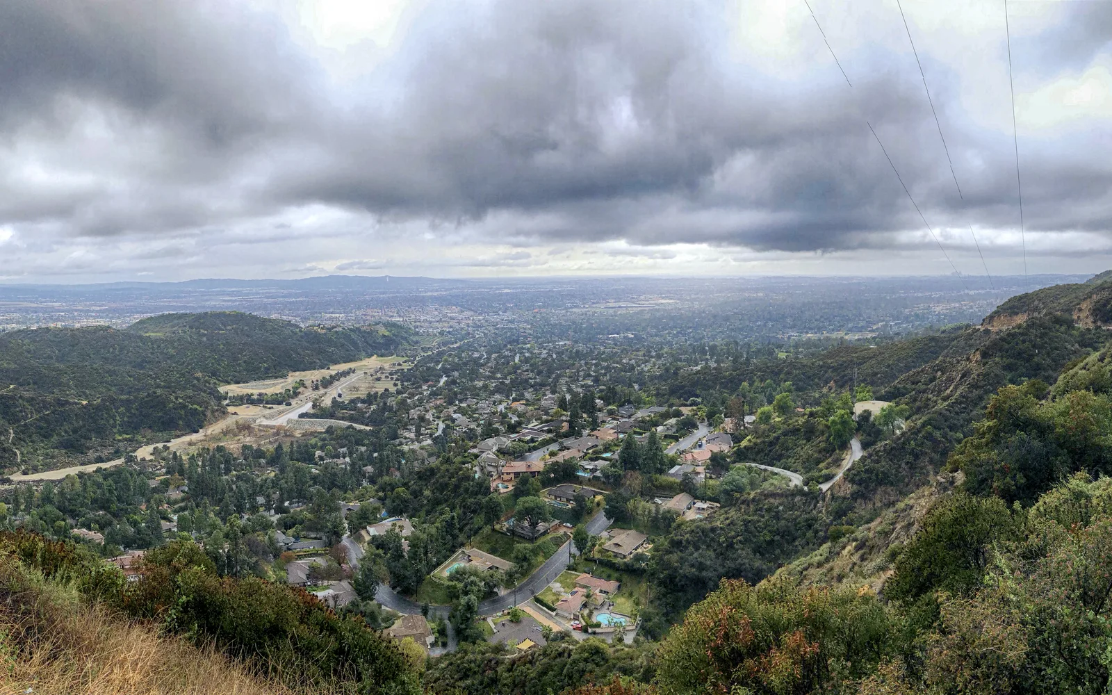 A panoramic view of a mountain road through the San Gabriel Mountains with scenic landscape views